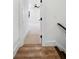 Hallway entrance featuring hardwood floors and neutral-toned walls at 2725 Starfish Dr, Johns Island, SC 29455