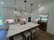 White kitchen with stainless steel appliances and a large marble island at 2725 Starfish Dr, Johns Island, SC 29455