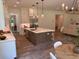 Open-concept kitchen featuring an island and dining area at 2725 Starfish Dr, Johns Island, SC 29455