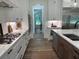 Bright kitchen with white cabinets, stainless appliances, and marble countertops at 2725 Starfish Dr, Johns Island, SC 29455