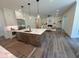 Spacious open-concept kitchen featuring a large island with marble countertop at 2725 Starfish Dr, Johns Island, SC 29455
