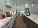 A modern kitchen with stainless steel appliances, marble countertops, and a stylish island at 2725 Starfish Dr, Johns Island, SC 29455