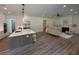 Open concept living space featuring a fireplace, neutral décor, and hardwood floors at 2725 Starfish Dr, Johns Island, SC 29455