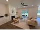 Cozy living room features shiplap accent wall, fireplace, and comfortable seating at 2725 Starfish Dr, Johns Island, SC 29455