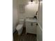 Stylish powder room features a vanity with a marble countertop and modern fixtures at 2725 Starfish Dr, Johns Island, SC 29455