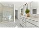 Bright bathroom featuring a glass shower, double sink vanity, patterned tile floor, and modern finishes at 279 Surf Bird Rd # 465, Summerville, SC 29486