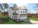 Charming two-story home with white siding, stone accents, and well-manicured front yard at 279 Surf Bird Rd # 465, Summerville, SC 29486