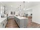 Modern kitchen with stainless steel appliances, gray cabinets, and a large center island at 279 Surf Bird Rd # 465, Summerville, SC 29486