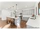 Well-lit kitchen featuring a large island with bar stools, and modern light gray cabinetry at 279 Surf Bird Rd # 465, Summerville, SC 29486