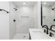 Updated bathroom boasting a marble-look tiled shower, dark fixtures and modern vanity at 2924 Chicora Ave, North Charleston, SC 29405