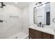 Bathroom boasts marble-look tiled shower, dark fixtures and a modern vanity with ample storage at 2924 Chicora Ave, North Charleston, SC 29405