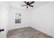 Bedroom features wood-look flooring, a ceiling fan and large window for ample natural light at 2924 Chicora Ave, North Charleston, SC 29405