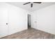 Bedroom with wood-look flooring, ceiling fan and ample natural light creates inviting space at 2924 Chicora Ave, North Charleston, SC 29405