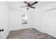 Charming bedroom featuring wood-look flooring, a ceiling fan, and a spacious closet at 2924 Chicora Ave, North Charleston, SC 29405