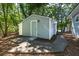 Exterior view showcasing the charming light blue home with a patio and yard at 2924 Chicora Ave, North Charleston, SC 29405
