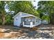 Charming blue bungalow with a welcoming front porch and lush landscaping at 2924 Chicora Ave, North Charleston, SC 29405