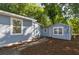Exterior view of two cozy homes with complementary light blue siding and well-kept grounds at 2924 Chicora Ave, North Charleston, SC 29405