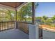 View from front porch shows wood railing and pillars with a brick base to the ground at 2924 Chicora Ave, North Charleston, SC 29405