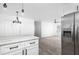 Bright kitchen featuring stainless steel refrigerator, modern fixtures, and stylish countertops at 2924 Chicora Ave, North Charleston, SC 29405