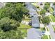 Aerial view showcases a large backyard with a fire pit area and mature landscaping at 3038 Penny Ln, Johns Island, SC 29455