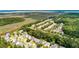 Scenic aerial view of a residential neighborhood surrounded by lush greenery and marshland at 3038 Penny Ln, Johns Island, SC 29455