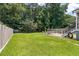 Wide backyard with picnic table, fire pit, lawn, patio, and partial fence at 3038 Penny Ln, Johns Island, SC 29455