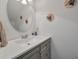 Bathroom sink with a decorative mirror and gray vanity at 3038 Penny Ln, Johns Island, SC 29455