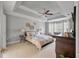 Spacious main bedroom with tray ceiling, a ceiling fan, and plenty of natural light at 3038 Penny Ln, Johns Island, SC 29455