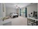 Bright bedroom with plenty of natural light, neutral walls, and a work desk area at 3038 Penny Ln, Johns Island, SC 29455