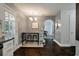 Dining area with dark wood flooring, a bar table with stools, and a chandelier at 3038 Penny Ln, Johns Island, SC 29455