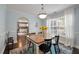 Light filled dining room with view into kitchen, and an archway to the dining room at 3038 Penny Ln, Johns Island, SC 29455