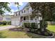 Charming two-story home with a welcoming front porch and beautifully landscaped yard at 3038 Penny Ln, Johns Island, SC 29455