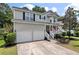 Beautifully maintained two-story home featuring a welcoming front porch and a two-car garage at 3038 Penny Ln, Johns Island, SC 29455