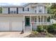 Inviting two-story home with a cozy front porch, well-maintained landscaping, and a two-car garage at 3038 Penny Ln, Johns Island, SC 29455