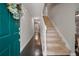 Warm foyer with hardwood floors, staircase, and natural light at 3038 Penny Ln, Johns Island, SC 29455