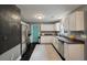 Kitchen featuring a chalkboard accent wall, stainless appliances, and white cabinetry at 3038 Penny Ln, Johns Island, SC 29455