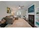 Spacious living room with a fireplace, hardwood floors, and view to dining area at 3038 Penny Ln, Johns Island, SC 29455
