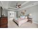 Comfortable main bedroom with ceiling fan and a view into the ensuite bathroom at 3038 Penny Ln, Johns Island, SC 29455