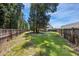 Spacious backyard with a trampoline, swings, and plenty of room to play at 307 Wilderland Ct, Moncks Corner, SC 29461
