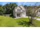 Charming two-story home with a well-maintained lawn and inviting curb appeal at 307 Wilderland Ct, Moncks Corner, SC 29461
