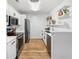 Well-lit kitchen with stainless steel appliances, white cabinets, and modern countertops at 307 Wilderland Ct, Moncks Corner, SC 29461