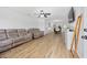 Bright living room with hardwood floors, ceiling fan, and a view to the dining area at 307 Wilderland Ct, Moncks Corner, SC 29461