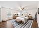 Stylish main bedroom features a ceiling fan and wood floors with neutral decor at 307 Wilderland Ct, Moncks Corner, SC 29461