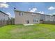 Exterior shot of backyard with grass and two story home at 314 Sanctuary Park Dr, Summerville, SC 29486