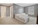 Spacious bedroom with a large white sofa and a walk in closet at 314 Sanctuary Park Dr, Summerville, SC 29486