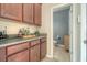 Butler pantry featuring a countertop and storage cabinets, conveniently located near a half bathroom at 314 Sanctuary Park Dr, Summerville, SC 29486