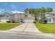 Charming two-story home with a well-maintained lawn and a two car garage, perfect for a growing Gathering at 314 Sanctuary Park Dr, Summerville, SC 29486