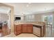Open kitchen area with granite countertops, sink, and dishwasher, flowing into the dining and living spaces at 314 Sanctuary Park Dr, Summerville, SC 29486