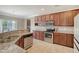 Modern kitchen with granite countertops, stainless steel appliances, and rich wood cabinetry offering ample storage at 314 Sanctuary Park Dr, Summerville, SC 29486