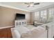 Bright living room with hardwood floors, large windows, and a comfortable sectional sofa at 314 Sanctuary Park Dr, Summerville, SC 29486